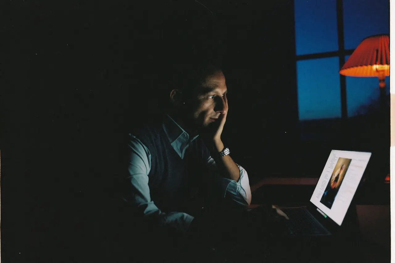A clinic owner reviewing results on a laptop after hours